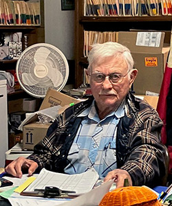 Dr. Le Tourneau working in his home office
